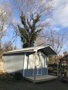 Custom shed outbuilding with sliding barn doors in maryland