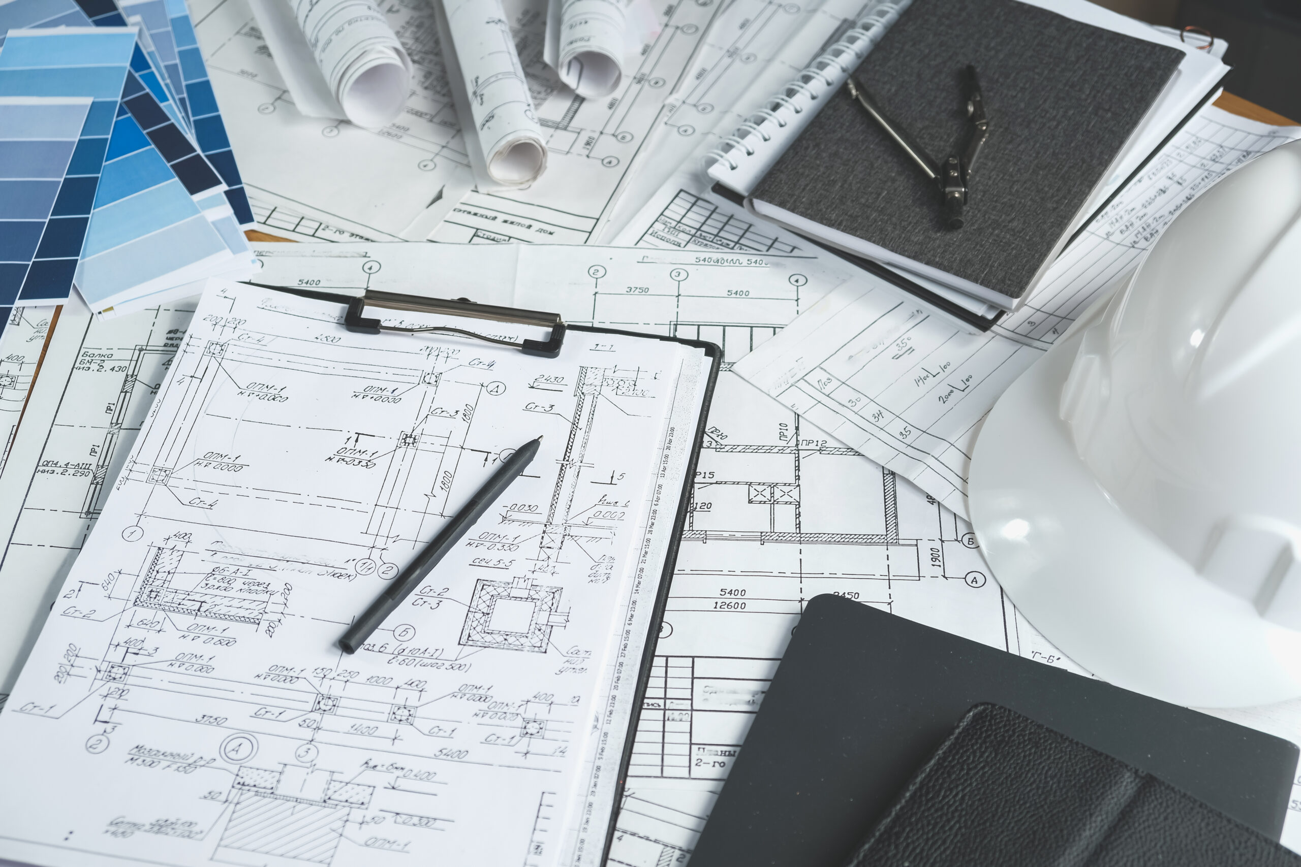 Construction drawings and tools on a desk