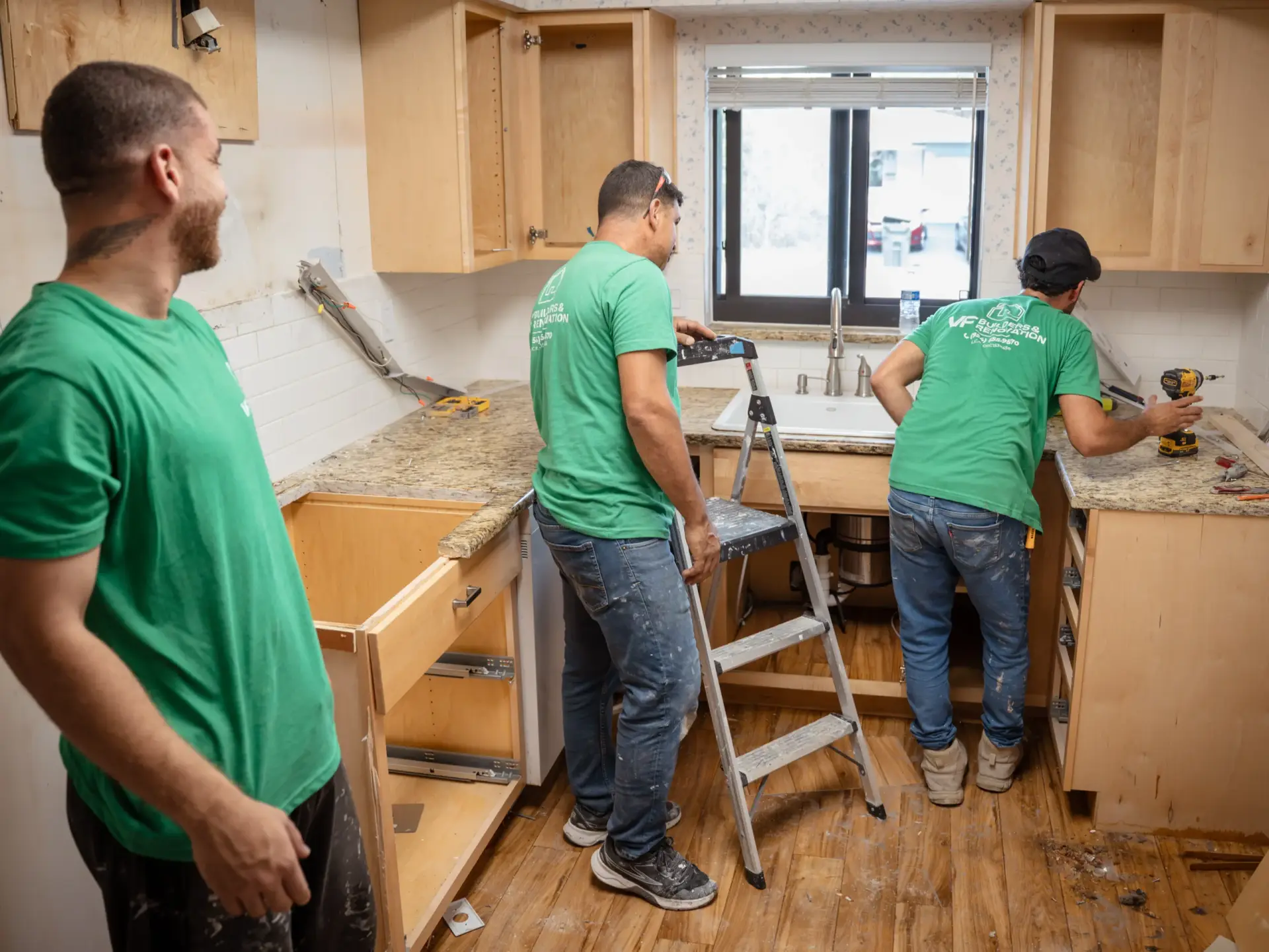 VF Builders crew installing kitchen cabinetry during a renovation