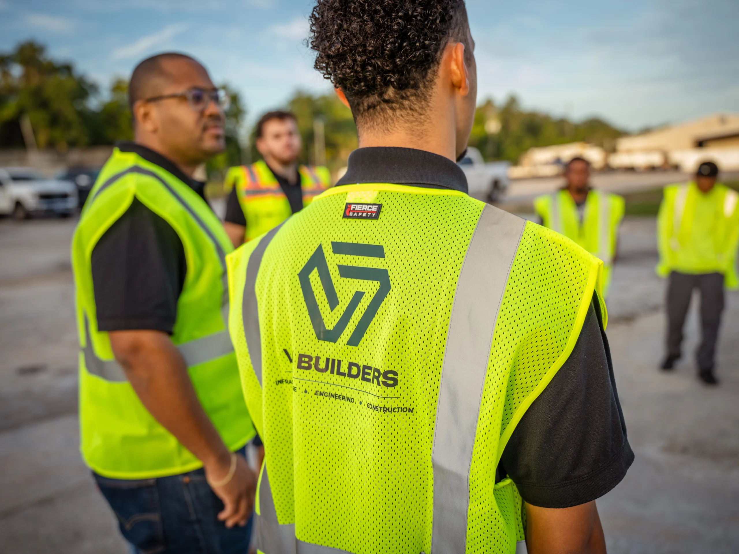 VF Builders crew in branded safety vests on a job site